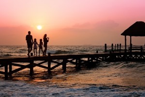 family on sea pier